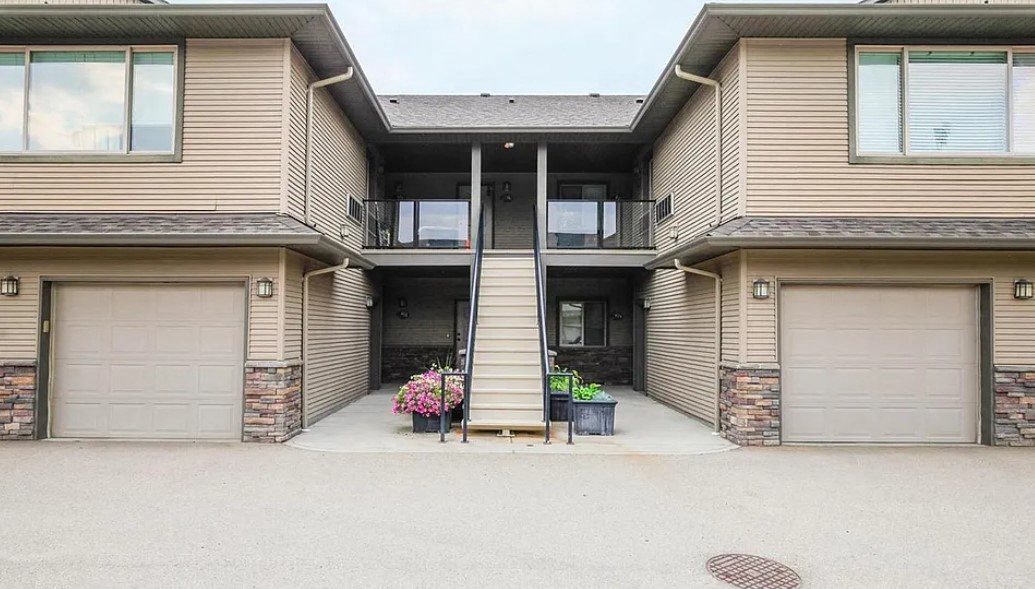 A two-story house with a garage on each floor.